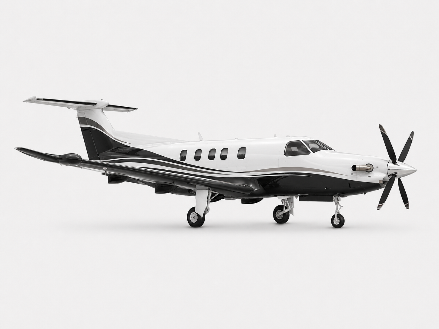 Pilatus PC-12 turboprop aircraft on simple white background